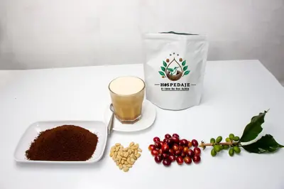 a table with a container of coffee and a plate of coffee beans at Hospedaje EL EDEN DE DON AYDEN in Satipo