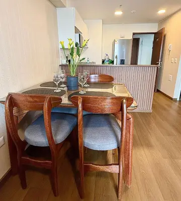 a dining room table with wine glasses on it at Tu refugio en Lima, moderno y céntrico in Lima