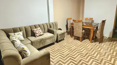 a living room with a couch and a table at Habitación privada a 20 min del aeropuerto de Lima in Lima