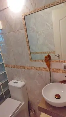 a bathroom with a toilet and a sink and a mirror at Alojate en Mala casa del valle in Mala