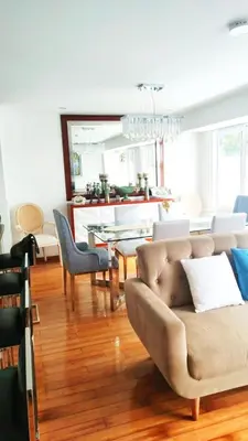 a living room with a couch and a table at Apartment modern full 3BR near Larcomar, Miraflores, Lima, Peru Sunset all days in Lima