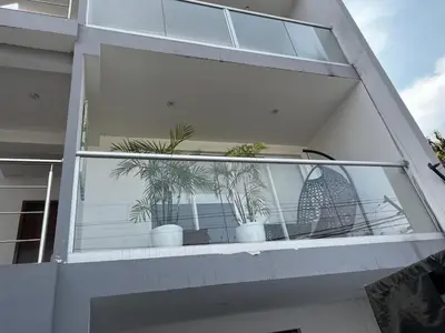 a window of a building with potted plants in it at Amplio y acogedor departamento de 130m2 - 2do piso in Lima