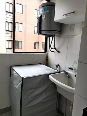 a small bathroom with a sink and a window at Adriana in Lima