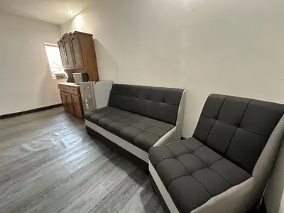 a living room with two couches in a room at Habitaciones para Turistas en Zona Tranquila de Cusco in Cusco
