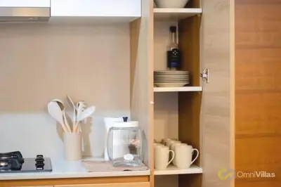 a kitchen with a cupboard with dishes and a sink at Elegant and cozy 2BR in Miraflores by Eco28 in Lima