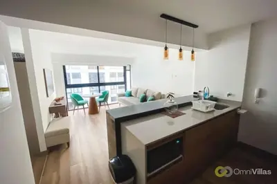 a kitchen and living room with a couch at Elegant and cozy 2BR in Miraflores by Eco28 in Lima