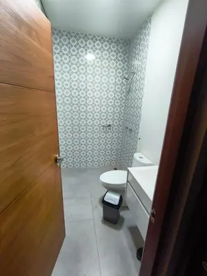 a bathroom with a toilet and a sink at La Morada del Sol in Cieneguilla