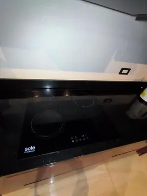 a black microwave with a screen on top of it at La Morada del Sol in Cieneguilla