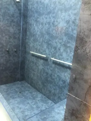 a bathroom with a shower with a glass door at Miraflores Penthouse in Lima