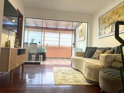 a living room with a couch and a table at Departamento en Santiago de Surco in Lima