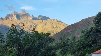 a view of a mountain with trees in the foreground at Cottage in nature in Sacred Valley with mountain views in Huayllabamba