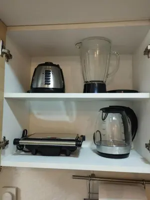 a kitchen shelf with a toaster and a blender at Panoramic view apartment in Lima