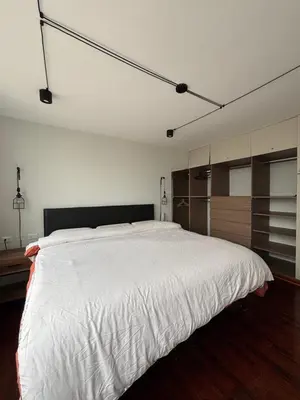 a bedroom with a large white bed in it at Mar Private Rooms in Lima