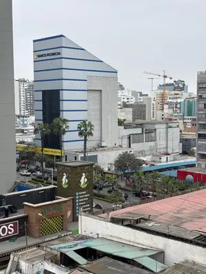 a view of a city with a tall building at Mar Private Rooms in Lima