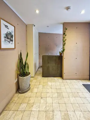 an empty room with a table and potted plants at Spacio 299 by Geko in Lima
