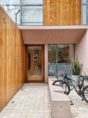 a bike is parked in front of a building at Spacio 299 by Geko in Lima