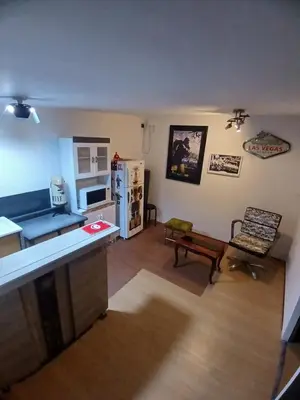 a kitchen and a living room with a refrigerator at Freestyle Home in Lima