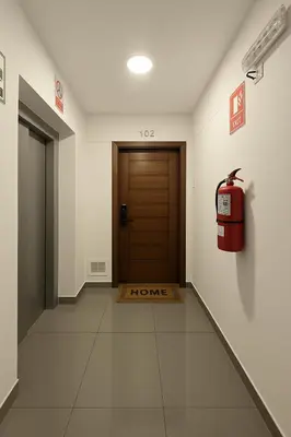 a hallway with a door and a fire hydrant at E Malecon Larcomar Free Parking 3B 102 in Lima