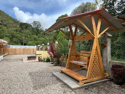 a wooden gazebo with a wooden roof at La posada del minero Oxapampa in Oxapampa