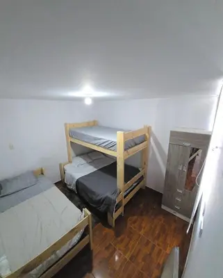 a small room with two bunk beds in it at In house ica in Ica