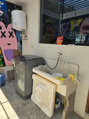 a bathroom with a sink and a trash can at Un house ica in Ica