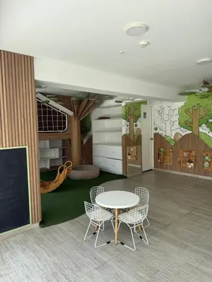 a classroom with a table and chairs and a chalkboard at Casa viajera - orla los topacios in Lima