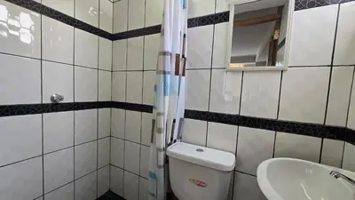 a bathroom with a toilet and a sink at Refugio Sagrado Boutique in Ollantaytambo