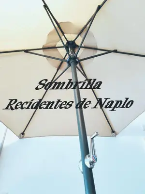 a white umbrella with the words santa ana replicates of avalonia at Confortable con vista al mar de Naplo, Pucusana in Pucusana