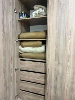 a closet with a bunch of folded towels at Miraflores premiere apartment in Lima