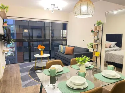 a living room with a couch and a table with chairs at Era 24 mala puntuacion in Lima