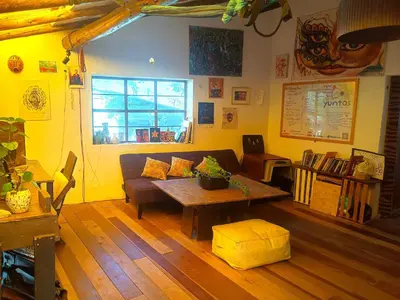 a living room with a couch and a table at Yuntawasi Cozy mini Ollantaytambo in Ollantaytambo