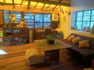 a living room with a couch and a table at Yuntawasi Cozy mini Ollantaytambo in Ollantaytambo
