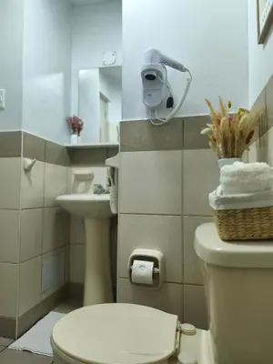 a bathroom with a toilet and a sink at Habitación Pequeña dentro departamento compartido 402 in Lima