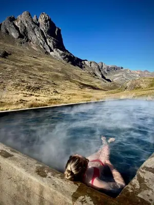 a woman floating in a body of water at Hotel Tambo del Inca in Cajatambo
