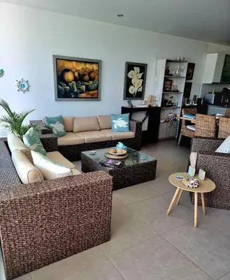 a living room with a couch and a table at Aqua y Sol Private Pool Parking Air Conditioning in Playa de Santa María