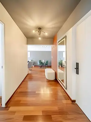 a hallway of a home with wood floors and a ceiling at Exclusive Apartment in Miraflores in Lima