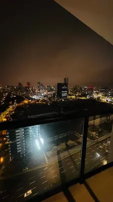 a view of a city at night from a building at Piso 25 con vista panorámica in Lima