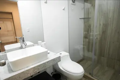 a bathroom with a toilet and a sink and a shower at iStay Atractivo corazón de Miraflores 2 Camas 2 Baños in Lima