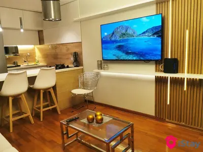 a living room with a flat screen tv on a wall at iStay Espectacular Vista Mar Miraflores in Lima