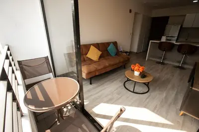 a living room with a couch and a table at iStay Nuevo 2D 2B Balcón in Lima
