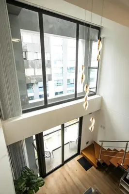 a room with a large window with lights at Mezanine Deluxe Miraflores in Lima