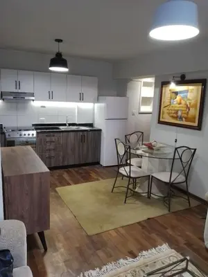 a kitchen and dining room with a table and chairs at Miraflores, Lima, apartamento 1 dormitorio in Lima