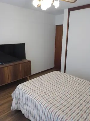 a bedroom with a bed and a flat screen tv at Miraflores, Lima, apartamento 1 dormitorio in Lima