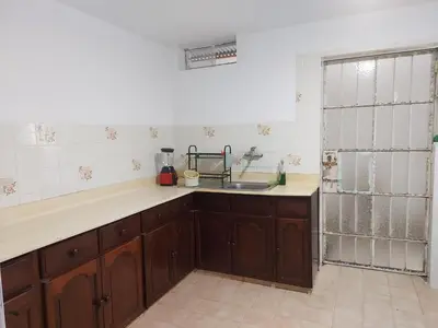 a kitchen with a sink and a counter top at KUSIHaus in Lima