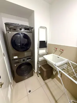 a laundry room with a washing machine and a sink at Inka Home VIP Luxury total 2 Private parking spaces in Lima