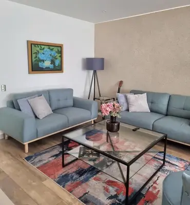 a living room with two couches and a glass table at Inka Home VIP Luxury total 2 Private parking spaces in Lima