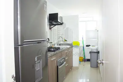 a kitchen with a stainless steel refrigerator at Cozy apartment in San Miguel in Lima