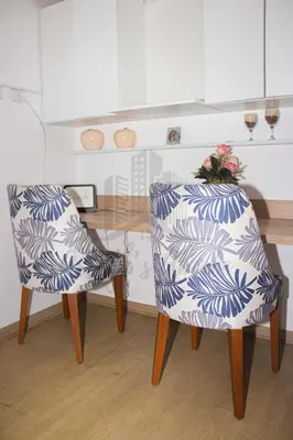 two chairs sitting at a table in a kitchen at Cozy apartment in San Miguel in Lima