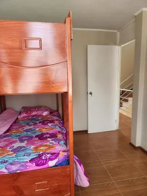 a bedroom with a bunk bed and a closet at Apartamento duplex en ICA in Pueblo Nuevo