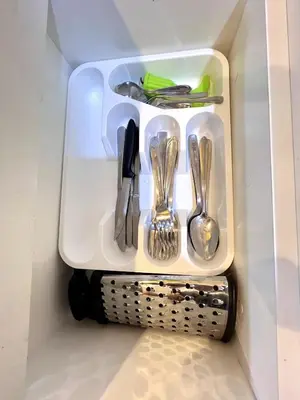 a white tray with utensils in a refrigerator at Downtown apartment in a residential area in Lima in Lima